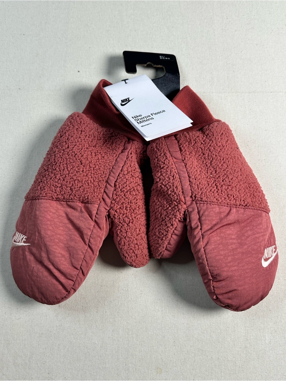 Nike Women's Sherpa Mittens in a warm Canyon Rust M/L